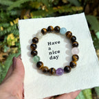Guardian of Inner Strength Tiger’s Eye Bracelet Set: Aquamarine, Amethyst, Rose Quartz, Green Strawberry Quartz & Gold Rutile Quartz