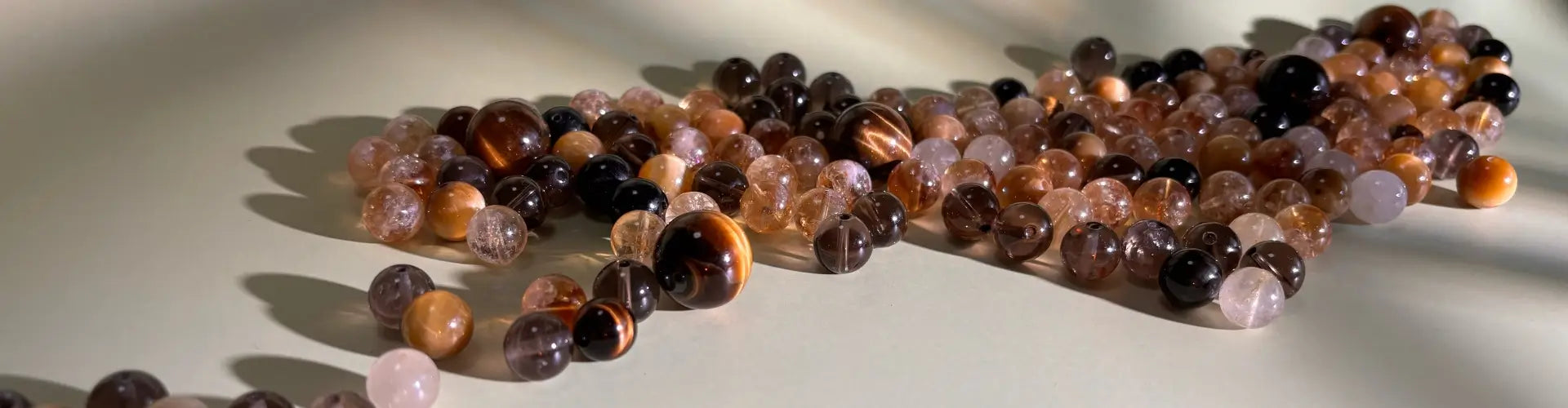 Earth element gemstones on a reflective surface